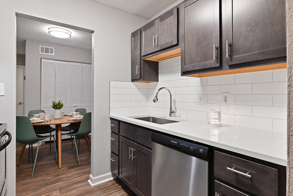 a kitchen and dining area in a 555 waverly unit at Premier Apartments, Georgia, 30168