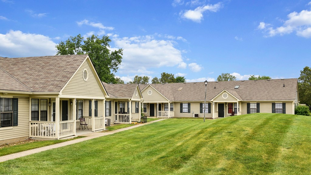 a row of houses with a large grassy area in front of them at Oak Run Apartment Homes, Ohio, 43228