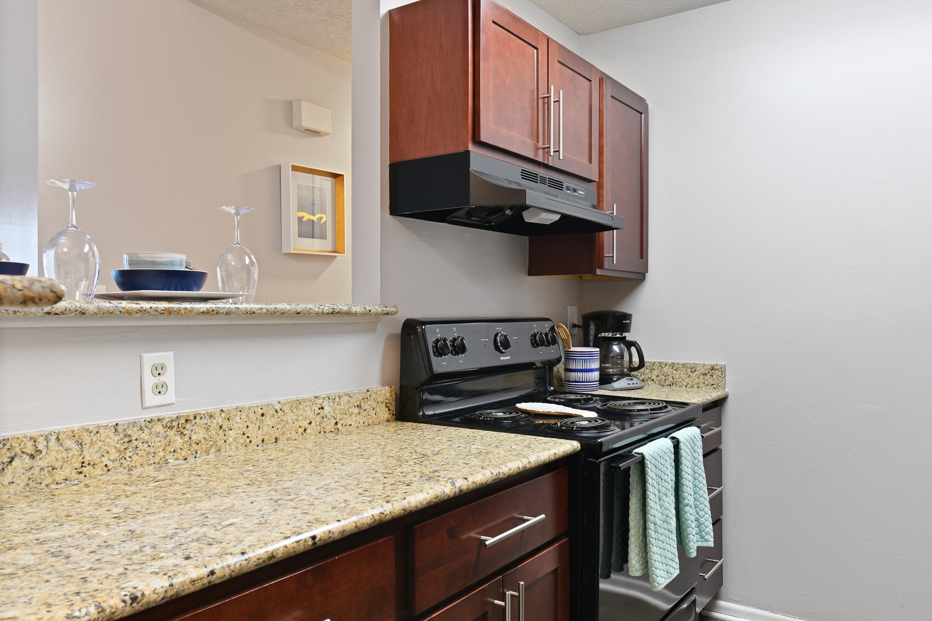 Newly updated kitchen with black appliances and granite countertops at Oak Run Apartment Homes, Columbus, OH, 43228