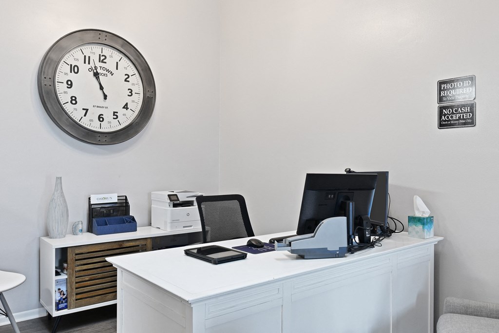 an office with a large clock on the wall at Oak Run Apartment Homes, Columbus, OH