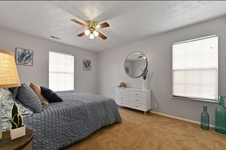 Spacious master bedroom with multiple windows for plenty of natural light at Oak Run Apartment Homes, Columbus, OH, 43228 - Photo Gallery 3