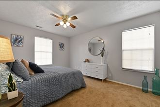 Spacious master bedroom with multiple windows for plenty of natural light at Oak Run Apartment Homes, Columbus, OH, 43228 - Photo Gallery