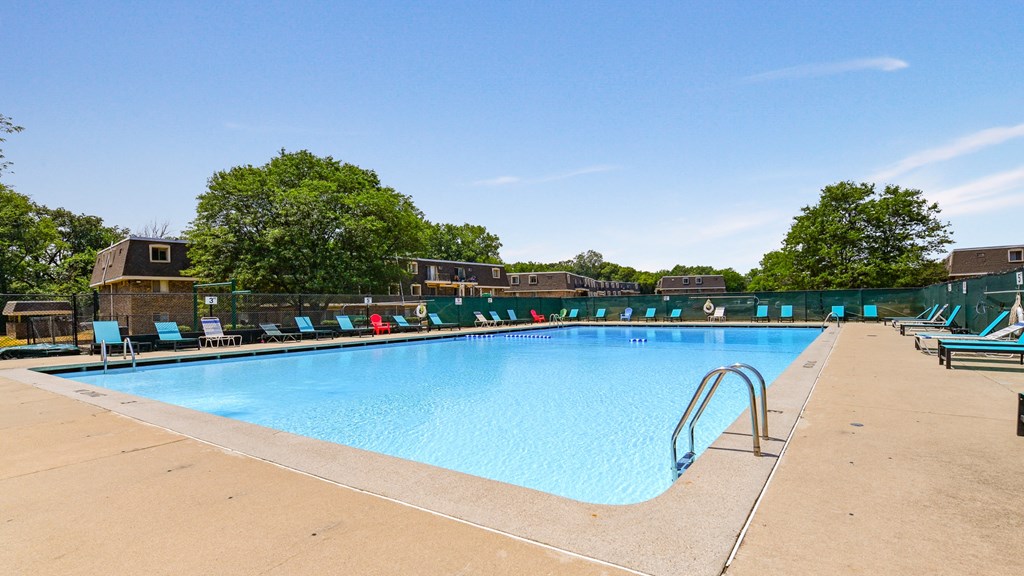Swimming pool with new seating area and lounge chairs at Aspen Ridge Apartments in West Chicago Illinois 60185