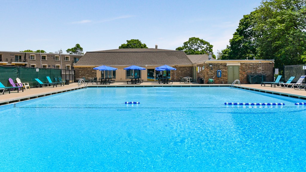 Crystal clear swimming pool with new renovated seating and lounge area at Aspen Ridge Apartments in West Chicago Illinois 60185
