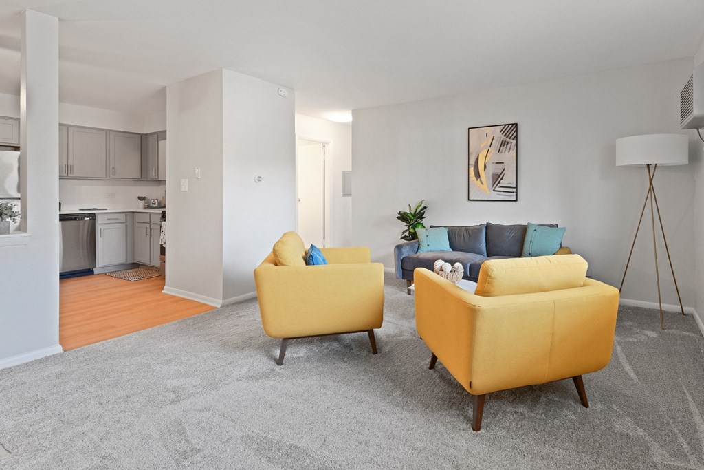New renovated kitchen opens up into spacious living room for open concept feel  at Aspen Ridge Apartments in West Chicago Illinois 60185