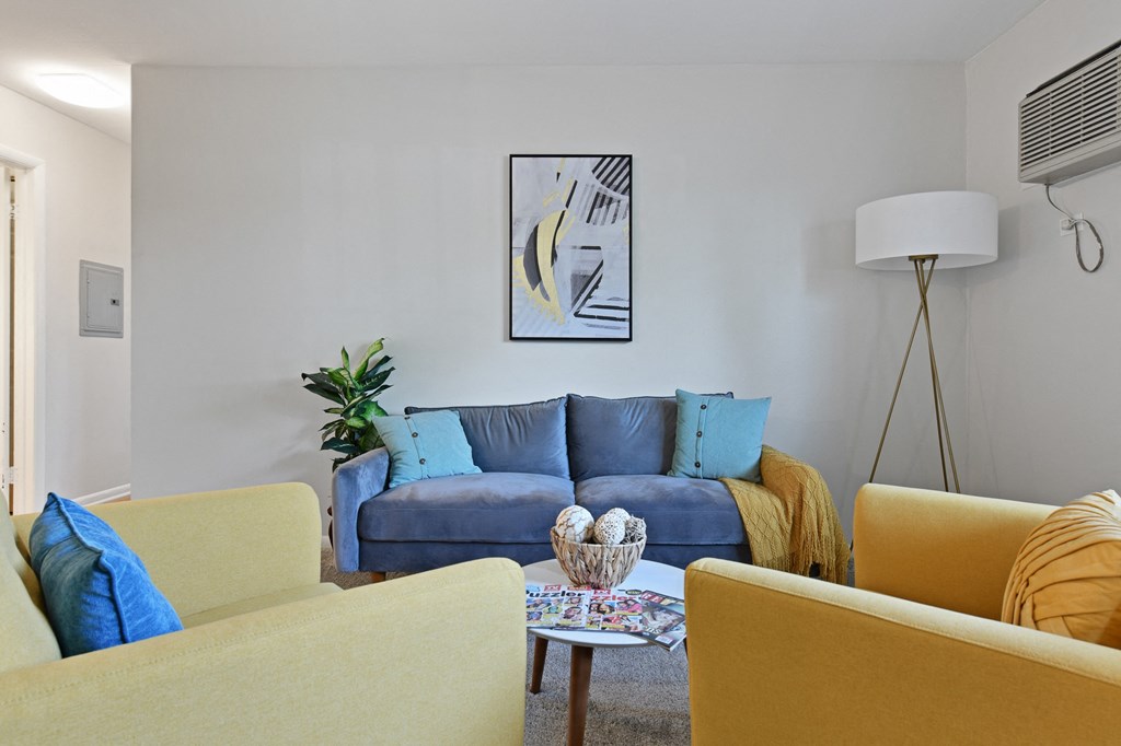 Spacious and cozy living room with natural light  at Aspen Ridge Apartments in West Chicago Illinois 60185