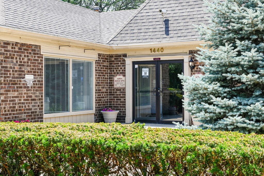 Leasing office surrounded by nature and greenery at Aspen Ridge Apartments in West Chicago Illinois 60185
