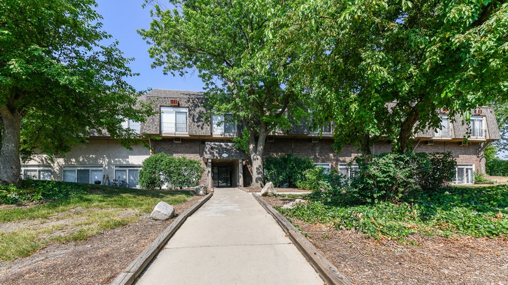 Scenic nature and greenery surround the buildings of beautiful Fox Run Apartments in St Charles IL 60174