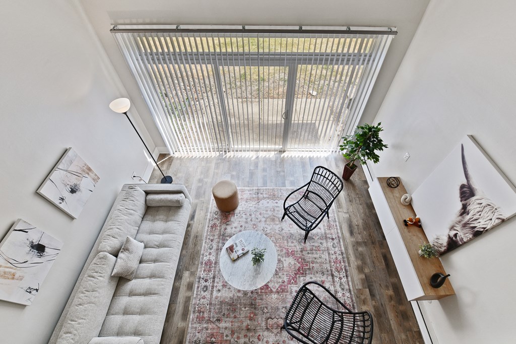 Showcasing the high ceilings with a loft view of the large, bright living room at Fox Run Apartments in St Charles IL 60174 at Fox Run Apartments, St. Charles, 60174