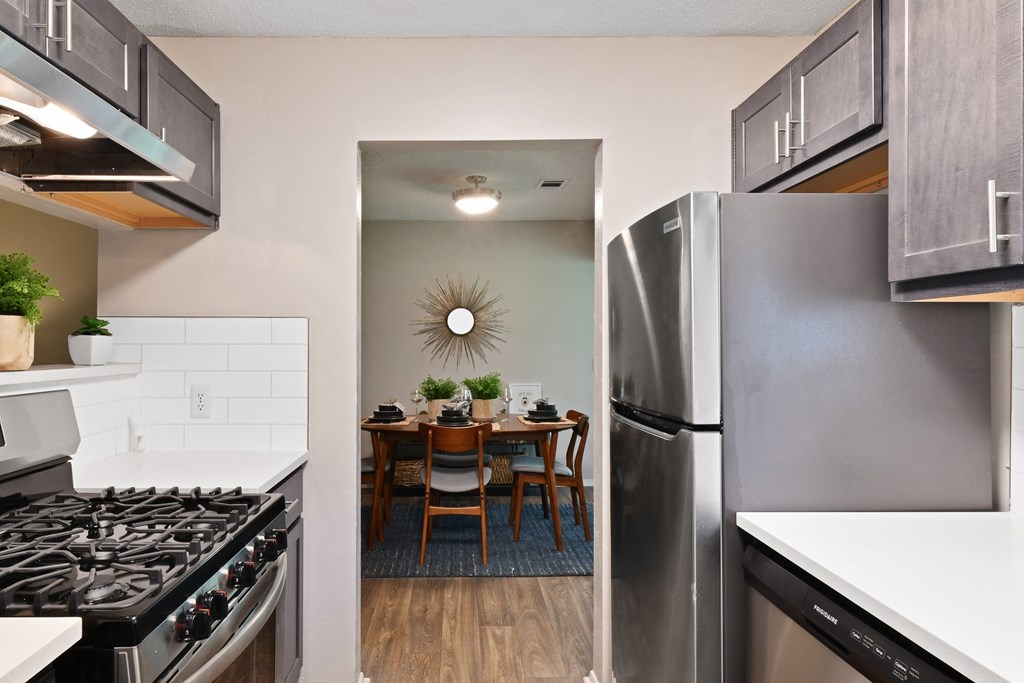 a kitchen and dining area in a 555 waverly unit at 300 Riverside Apartments, Austell