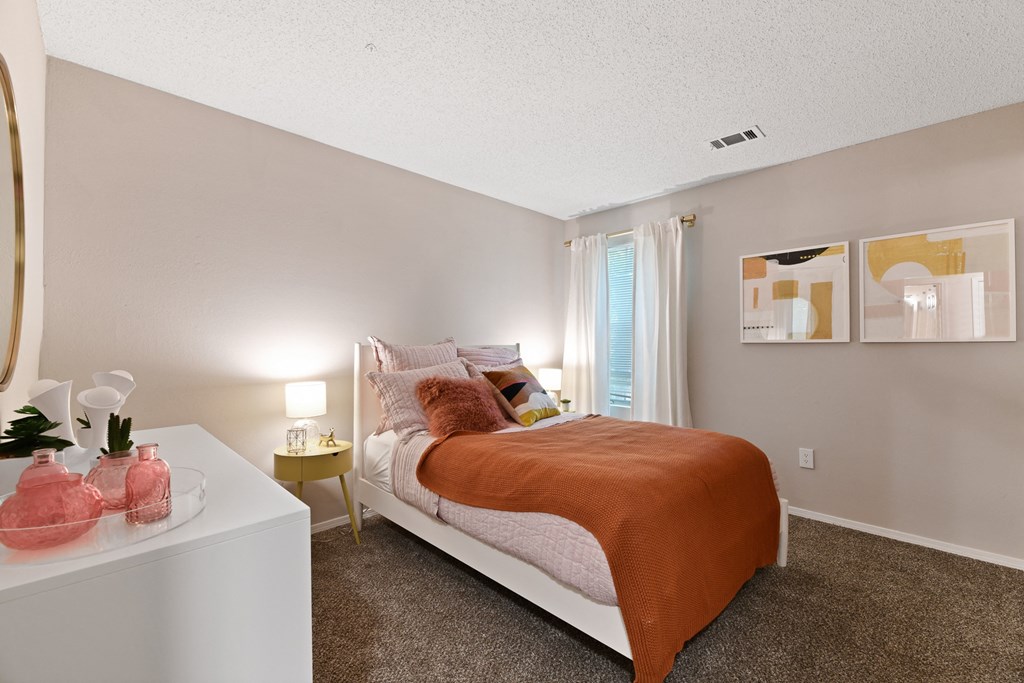 a bedroom with a bed and a window at 300 Riverside Apartments, Austell, Georgia