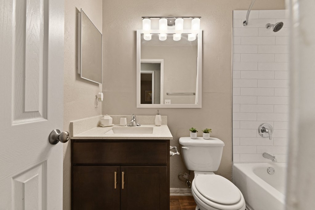 a bathroom with a sink toilet and bathtub at 300 Riverside Apartments, Georgia, 30168
