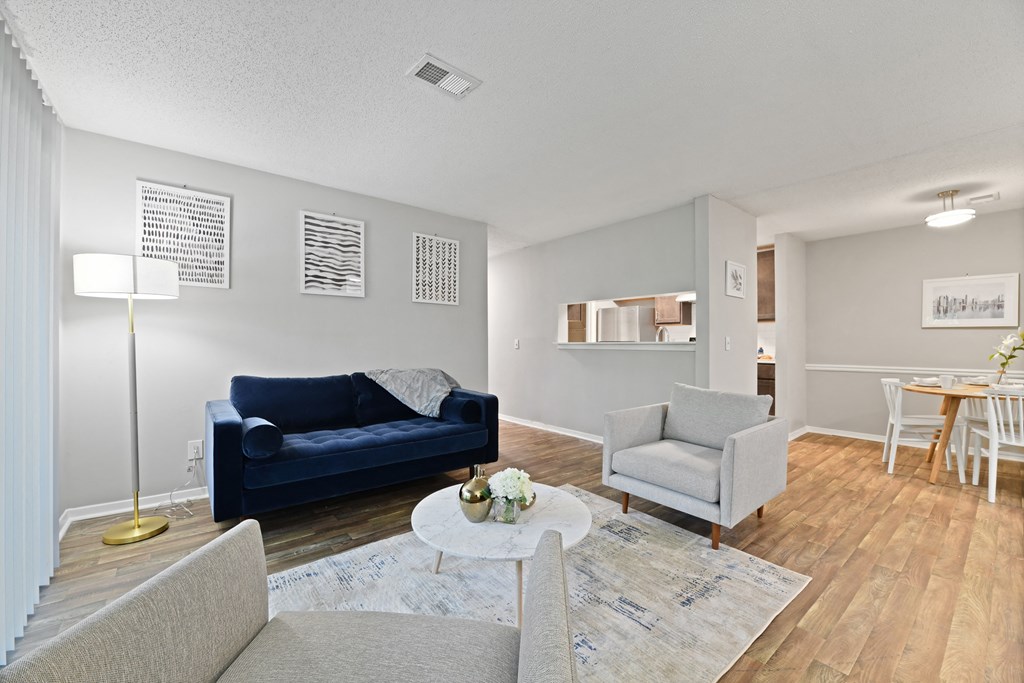 a living room with two couches and two chairs at Waldan Pond Apartments, Acworth, Georgia
