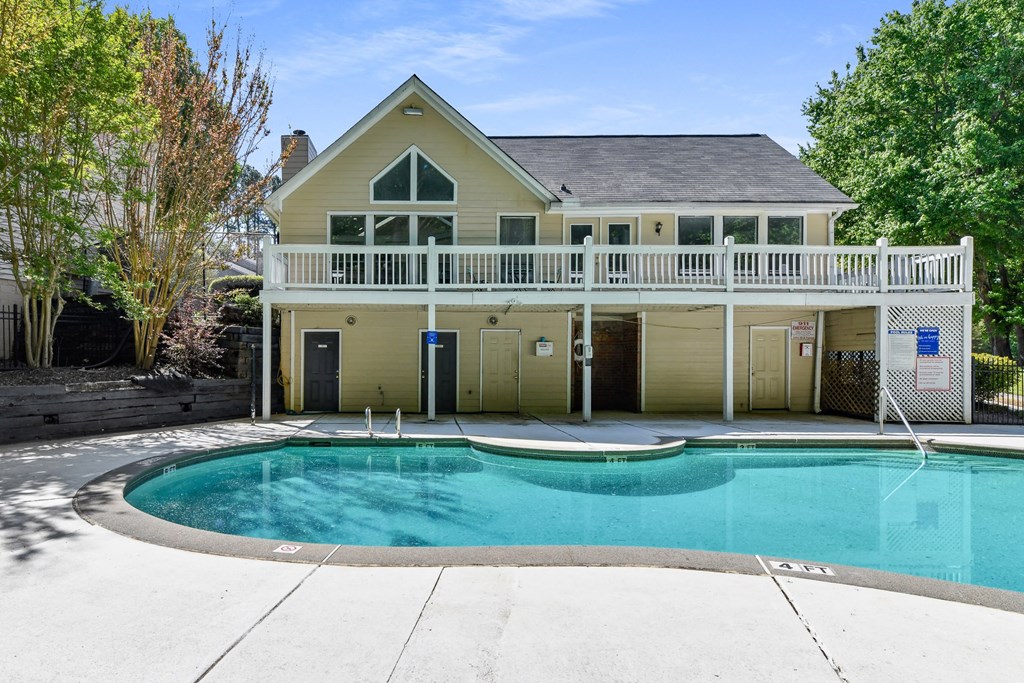 the clubhouse with a swimming pool in front of it at Waldan Pond Apartments, Georgia, 30102