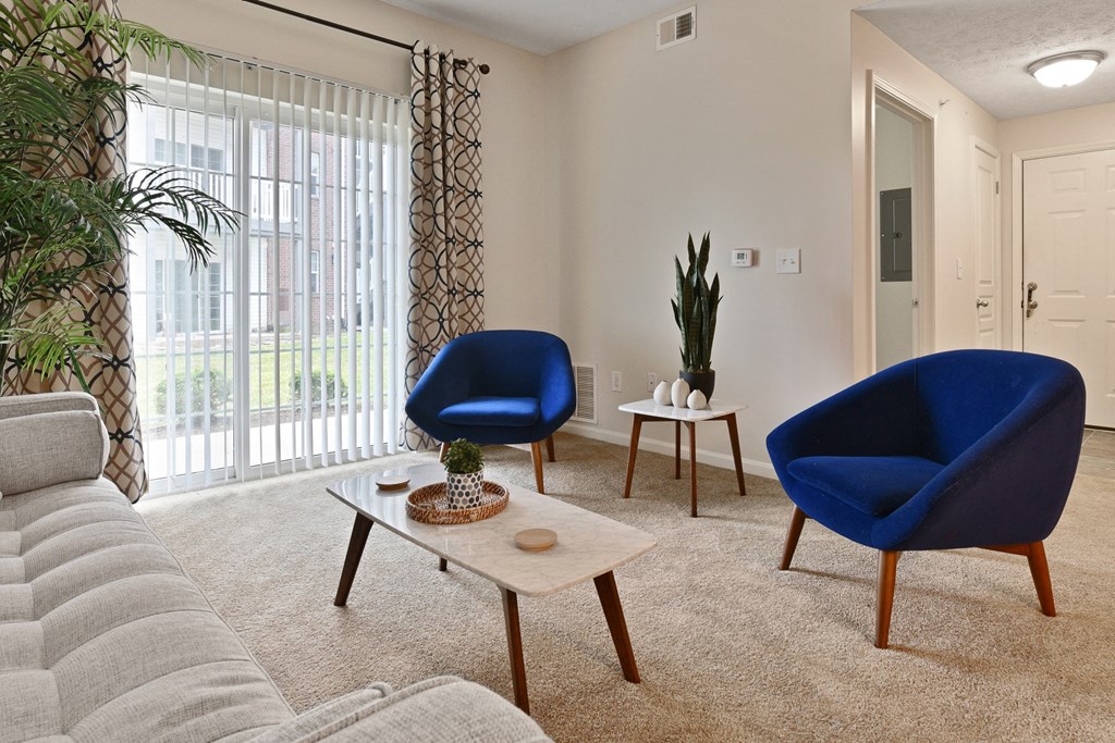 Cozy living room with view of private patio at The Reserves of Thomas Glen, Shepherdsville, KY, 40165