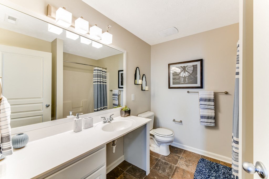 Bathroom with large vanity and bright lights at The Reserves of Thomas Glen, Shepherdsville, KY, 40165