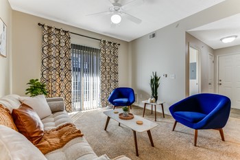 Living room with pulled curtains and blue chairs - model 9 - Photo Gallery 8