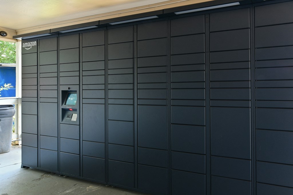 a garage door with black panels and a mailbox on it