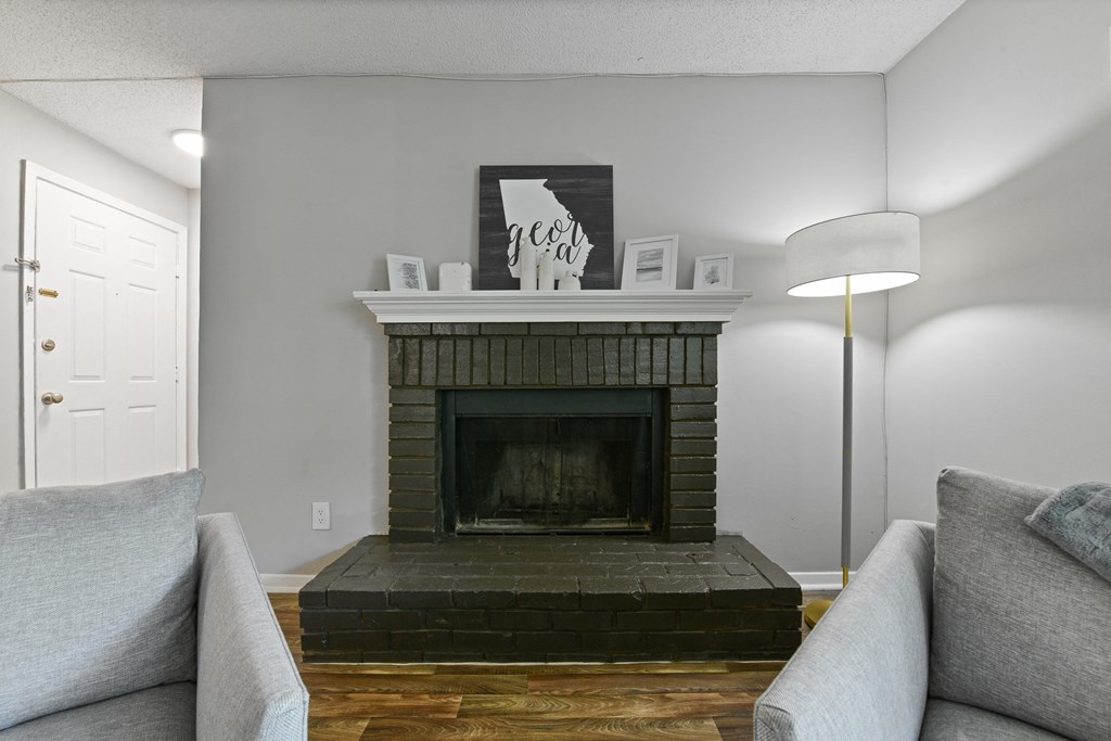 a living room with a fireplace and a couch