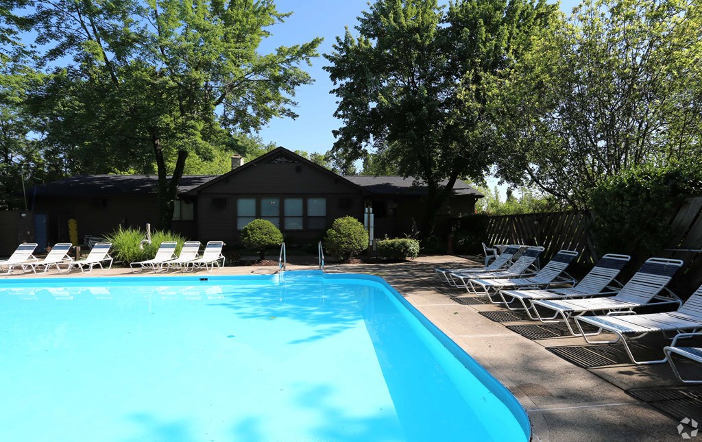 a swimming pool in front of a house