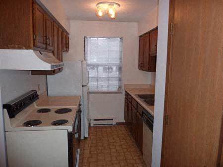 a kitchen with a stove and a refrigerator