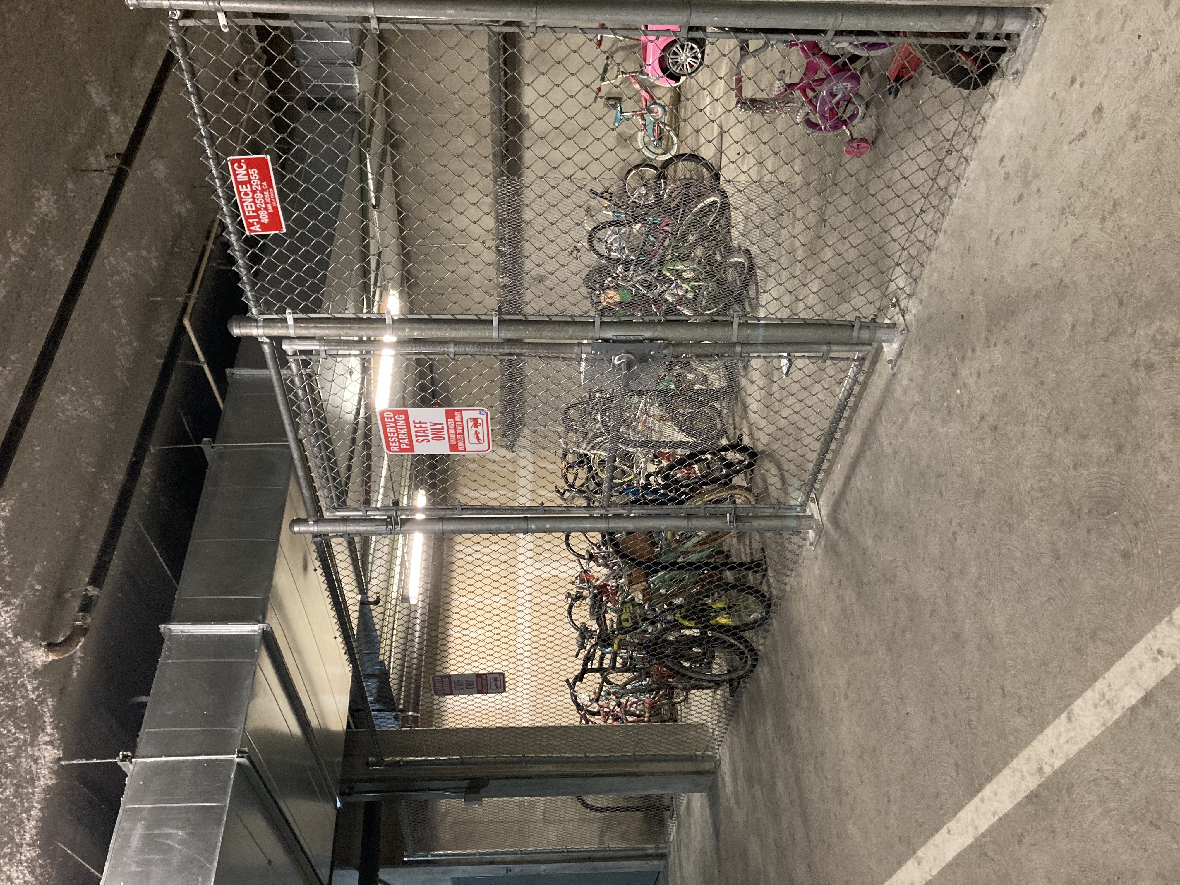 A metal rack with a red sign on it.