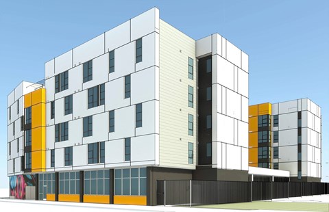 A modern building with white and yellow accents.