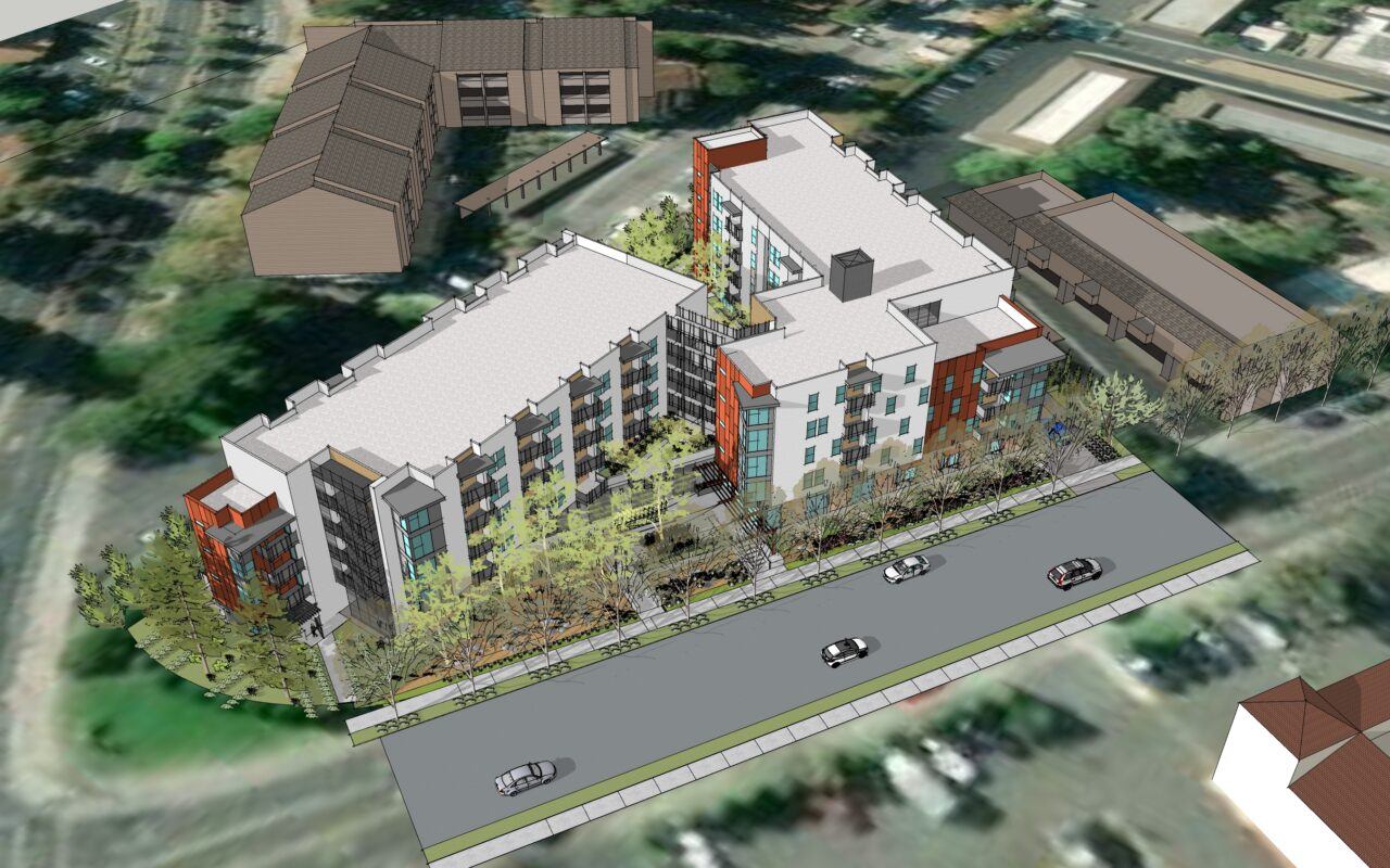A rendering of a modern building with a parking lot in front.