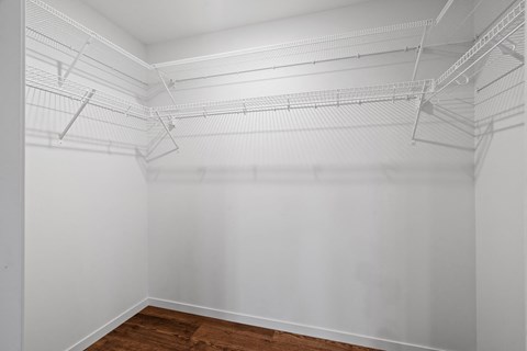 room with white walls and a wood floor