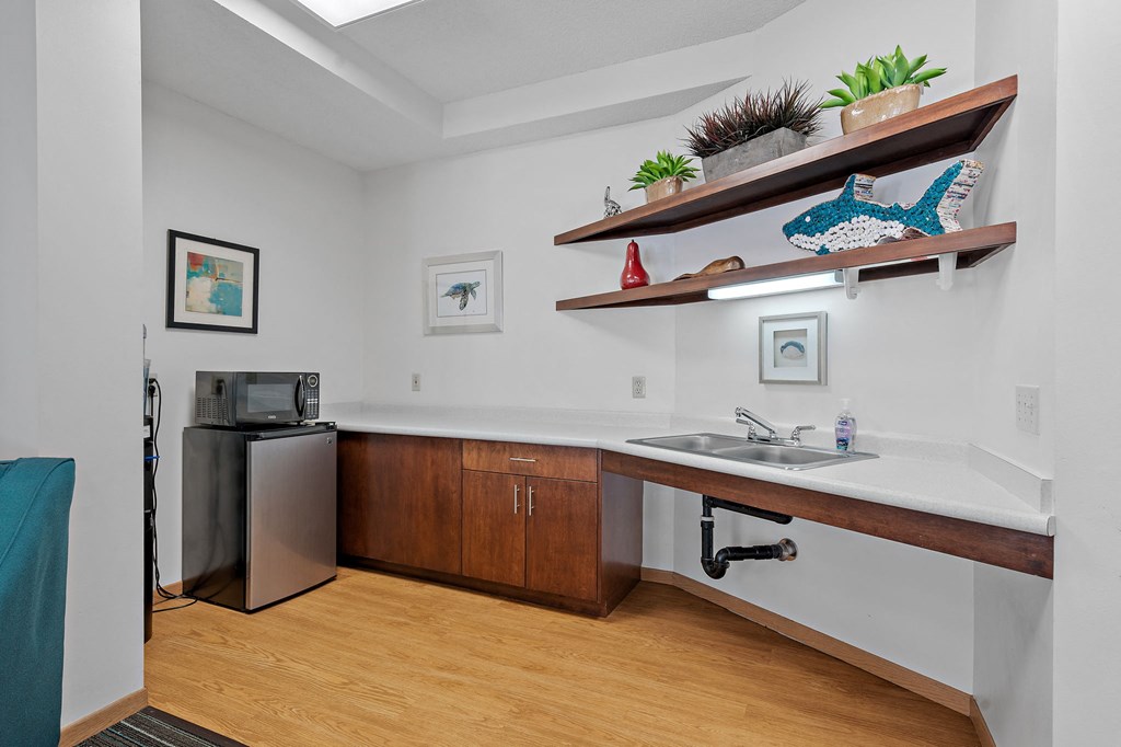 a kitchen with a sink and a refrigerator