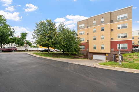an apartment building with a street in front of it