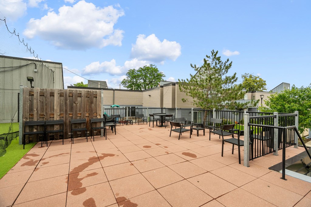 a patio with tables and chairs on a patio