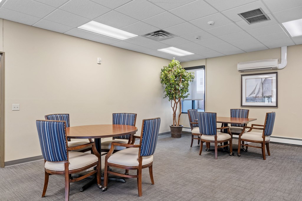 a rendering of a dining room with a table and chairs and arrows on the walls