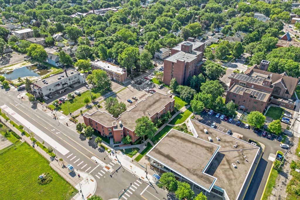 an aerial view of a city with buildings and trees