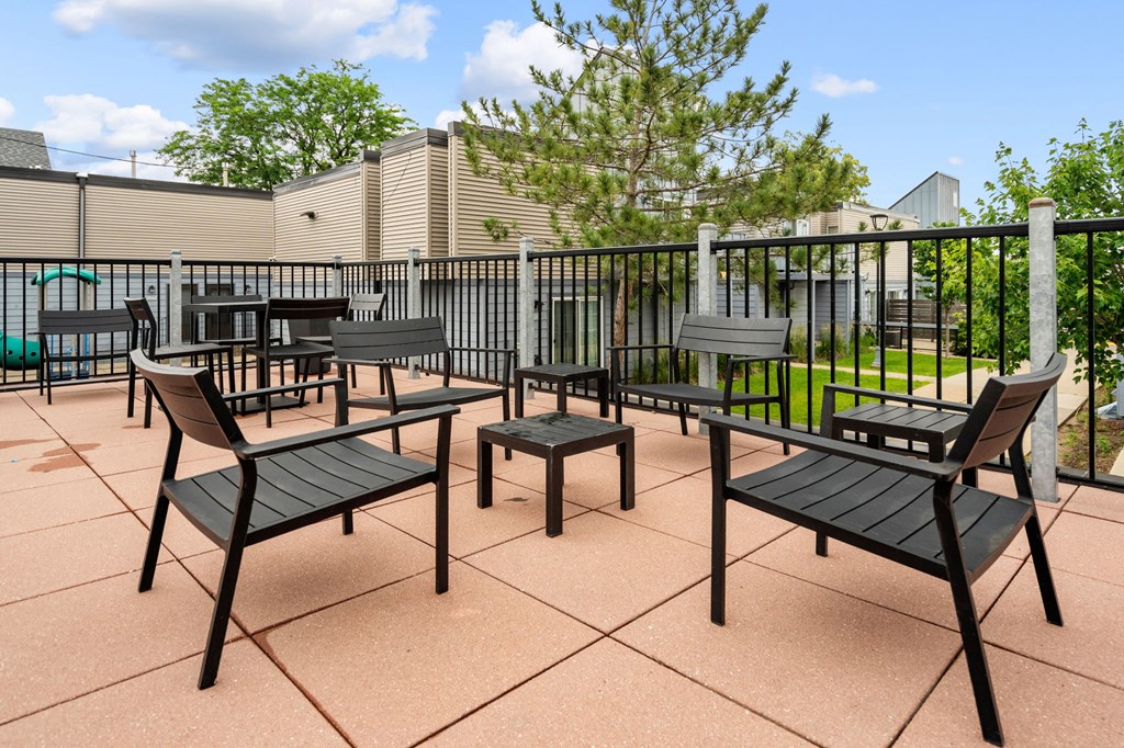 the patio of our apartments has tables and chairs
