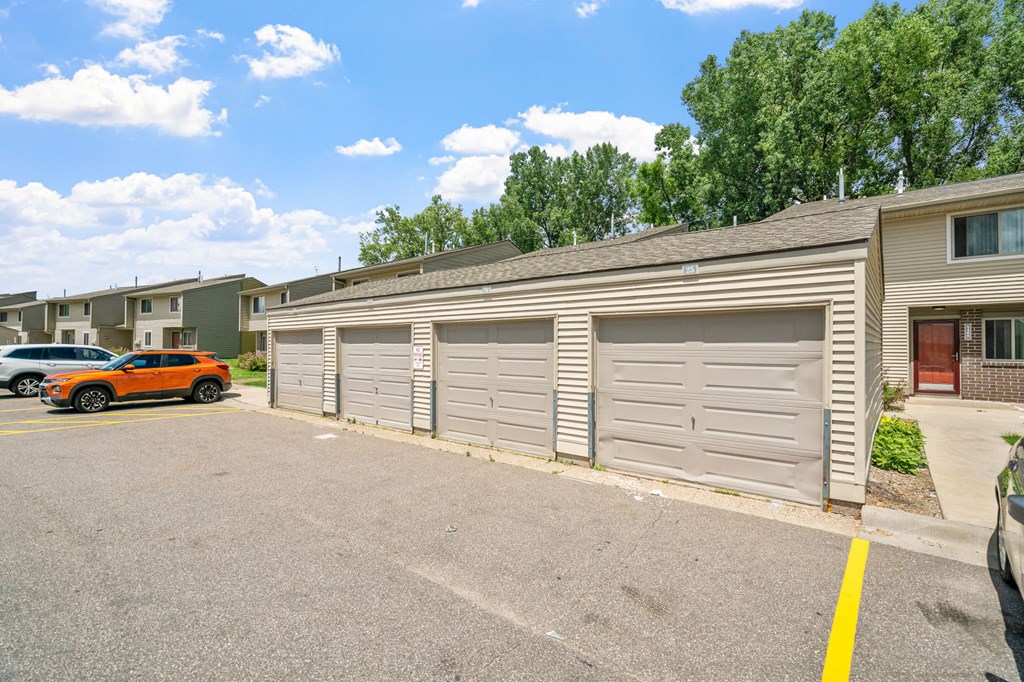 a garage with a car parked in front of it