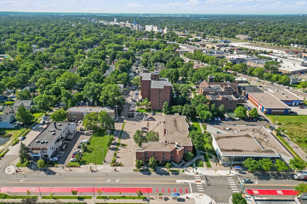 an aerial view of a city with buildings and trees