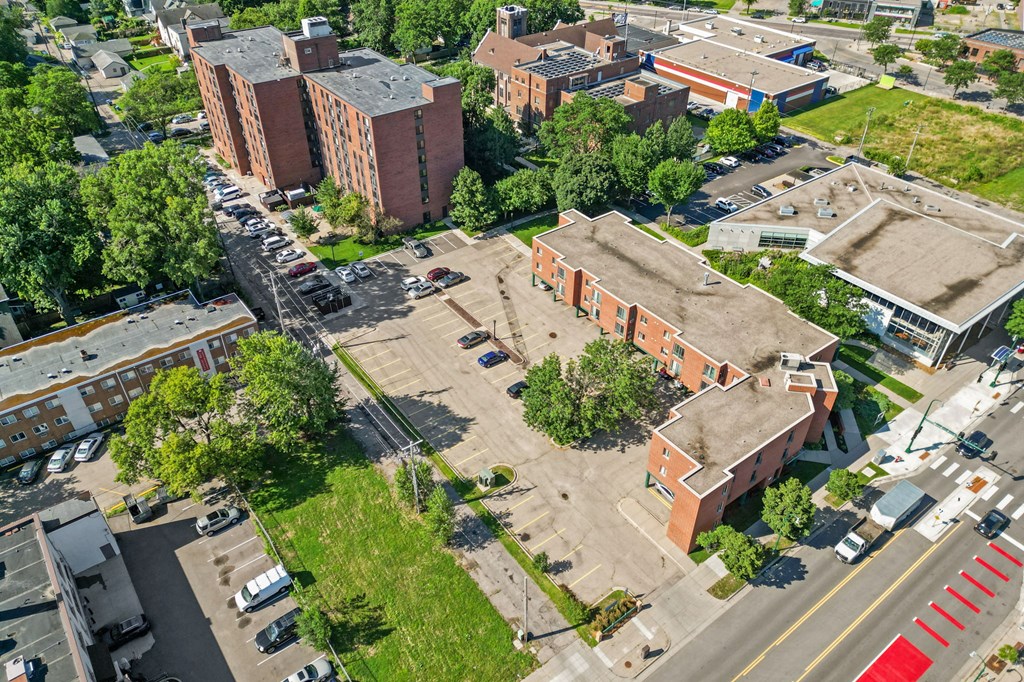 an aerial view of a city with buildings and trees