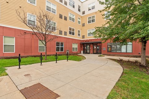 a courtyard of a building with a star pattern on the sidewalk