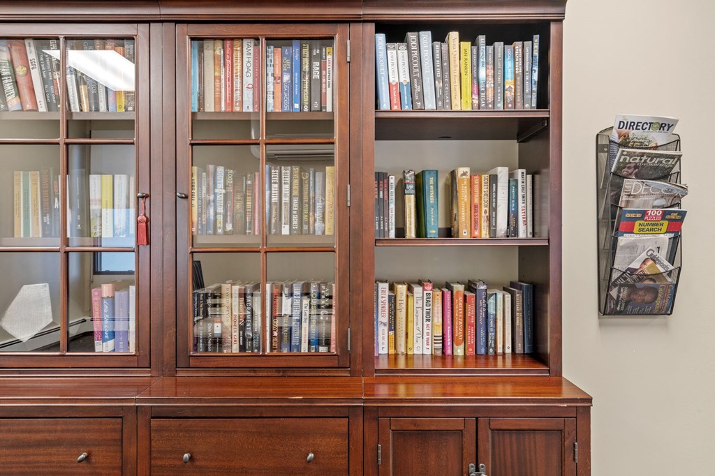 a bookshelf filled with books in a room