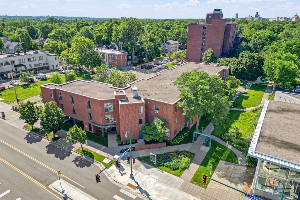 an aerial view of a brick building on a city street