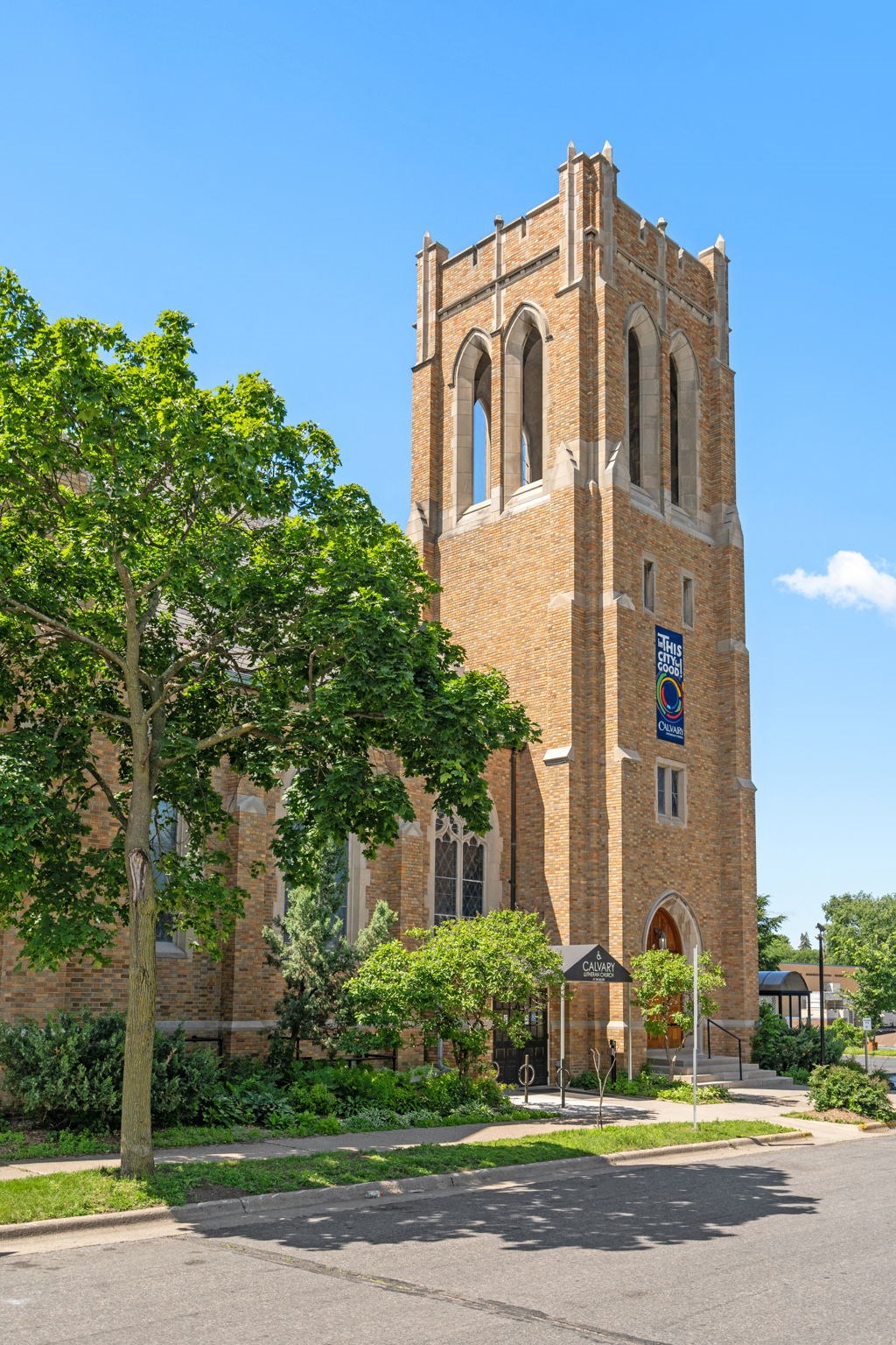a tall brick church with a clock tower