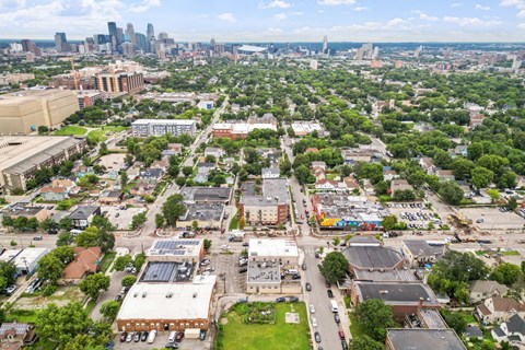 an overhead view of an apartment complex with trees