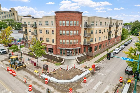 a construction site in front of a large brick building