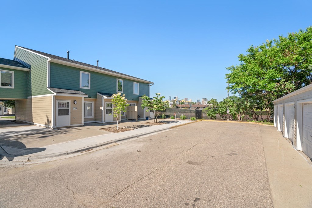 an empty street with houses on both sides of it
