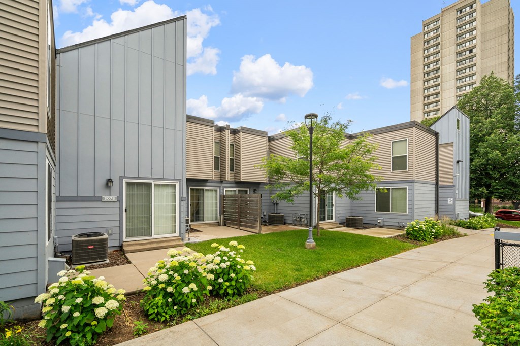 our apartments have a spacious courtyard with green grass and flowers