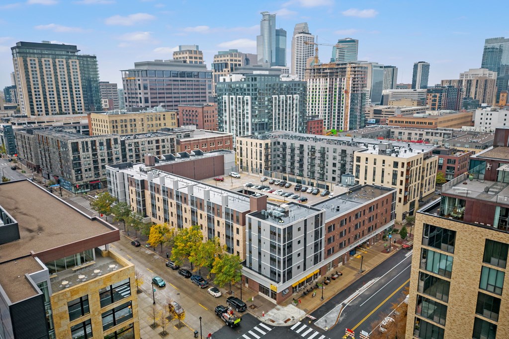 an aerial view of a city with buildings and skyscrapers