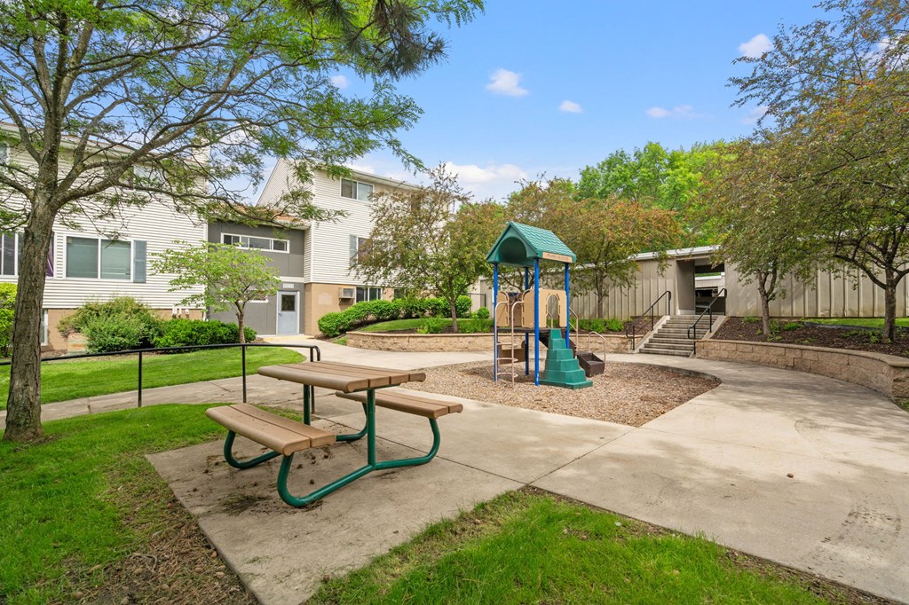 the preserve at ballantyne commons park with playground and picnic table