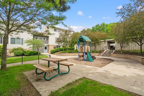 the preserve at ballantyne commons park with playground and picnic table