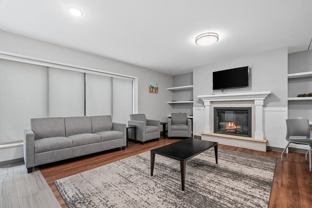 a living room with a fireplace and couches
